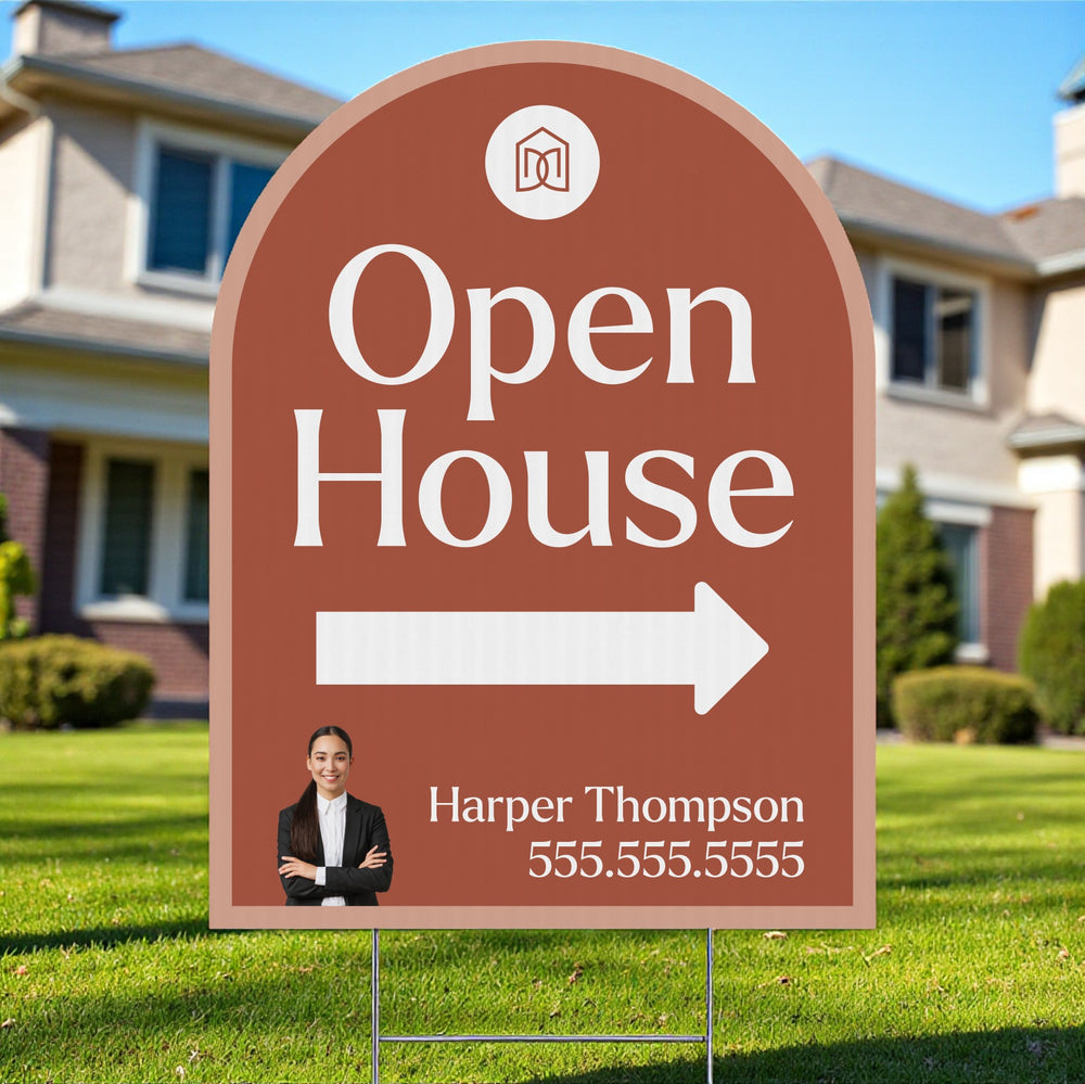 Open house areal estate arch shaped sign with a person's photo and contact information in front of a house.