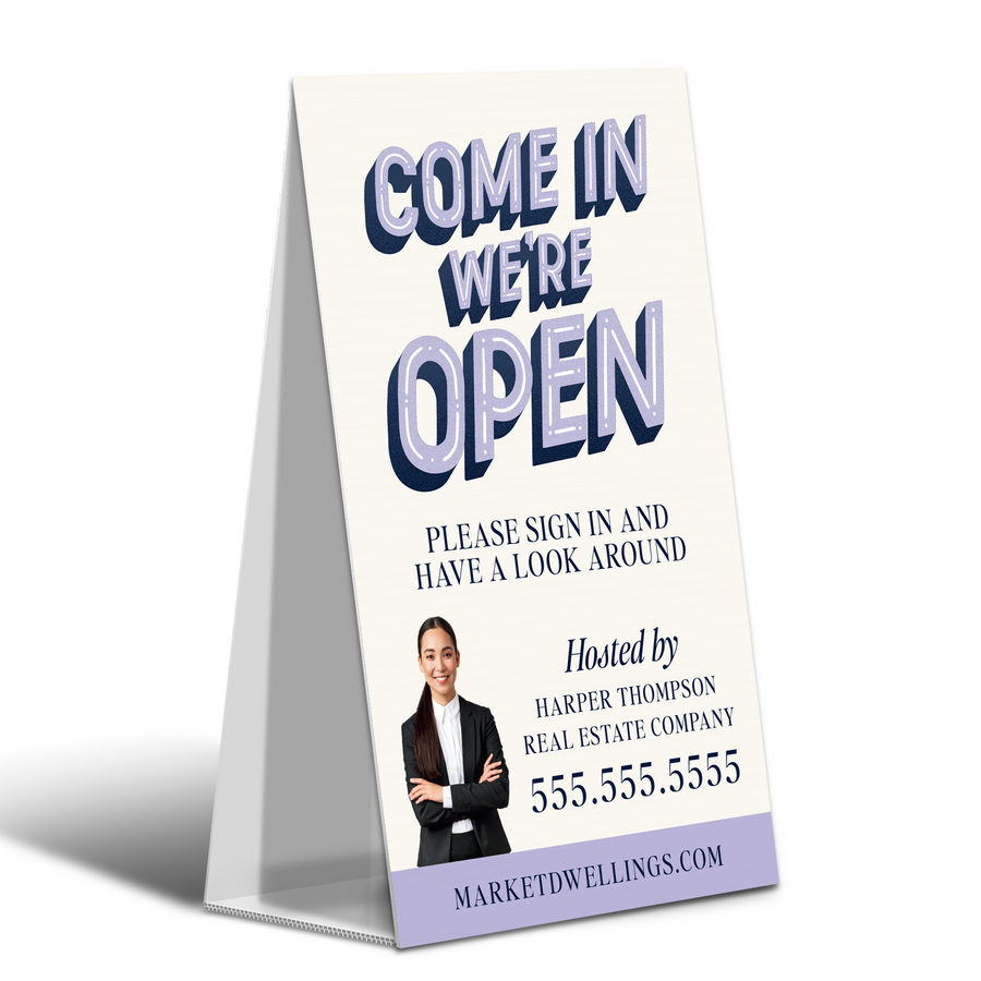 Real estate open house sign with contact information on a white background